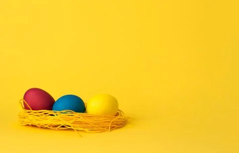 Painted chicken eggs on a yellow background. Easter eggs. copyspace Stock Illustration