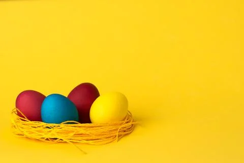 Painted chicken eggs on a yellow background. Easter eggs. copyspace Stock Illustration