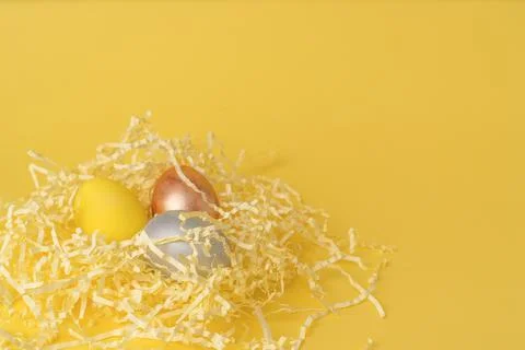 Painted chicken eggs on a yellow background. Easter eggs. copyspace Stock Illustration