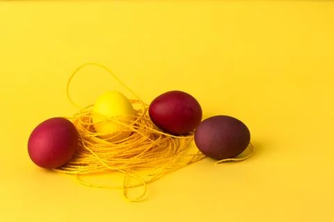 Painted chicken eggs on a yellow background. Easter eggs. copyspace Stock Illustration