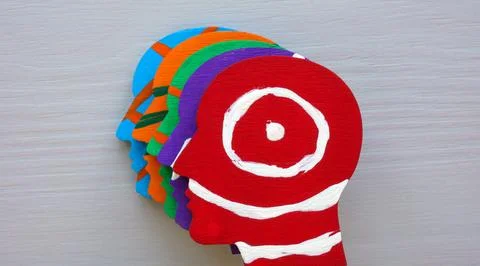 Painted colored heads as a concept of multiculturalism and diversity. Stock Photos