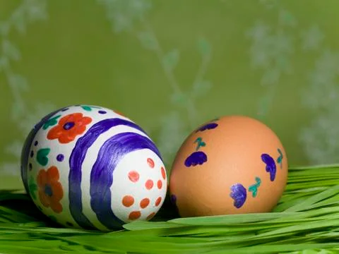 Painted Colorful Easter Eggs on green Grass Stock Photos