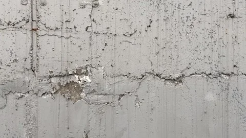 Painted concrete wall with plenty of cracks, holes and other defects Stock Footage 159086893