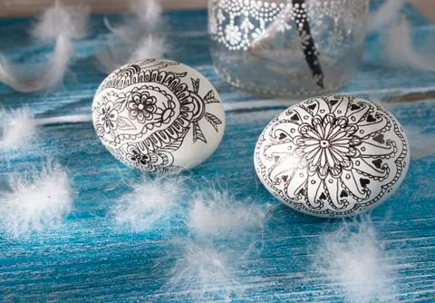 Painted doodle easter eggs on green grass Stock Photos