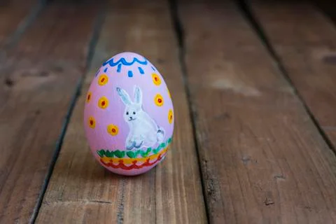 Painted easter chicken egg, drawing of a white rabbit Stock Photos