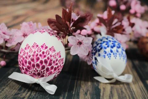 Painted Easter egg with cherry branch Stock Photos