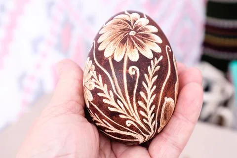Painted Easter egg on the palm Stock Photos