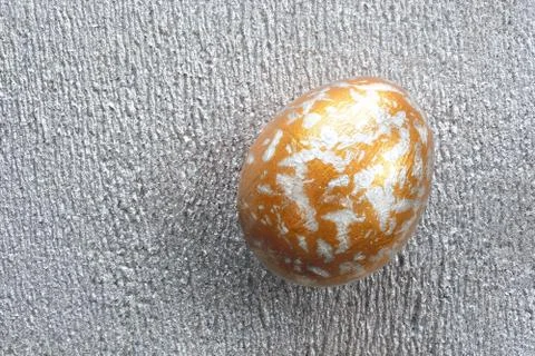 Painted easter egg on a silver background Foto stock