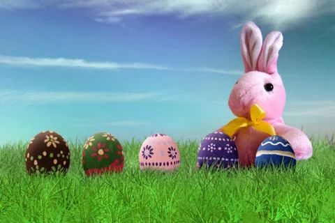 Painted Easter eggs and pink bunny Stock Photos