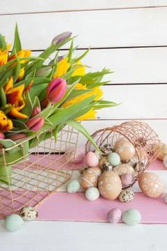 Painted easter eggs and tulips Stock Photos