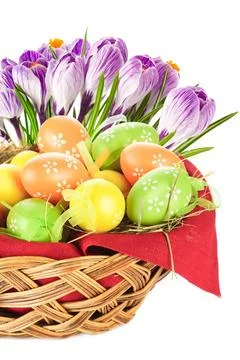 Painted easter eggs in basket and spring flowers Painted easter eggs in ba... Stock Photos