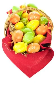 Painted easter eggs in basket Painted easter eggs in basket isolated on wh... Stock Photos
