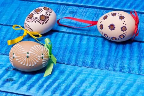 Painted Easter eggs on the blue table Stock Photos