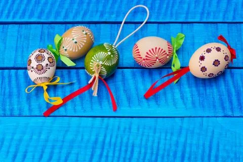 Painted Easter eggs on the blue table Stock Photos