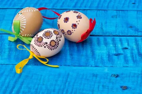 Painted Easter eggs on the blue table Stock Photos