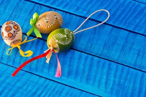 Painted Easter eggs on the blue table Stock Photos