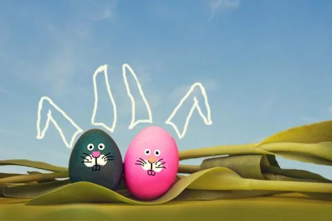 Painted Easter eggs with bunny face and blue sky, lying in tulips, easter spring Stock Photos