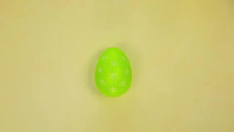 Painted Easter eggs changing colors top view,seamless looping animation of Stock Footage 233183238