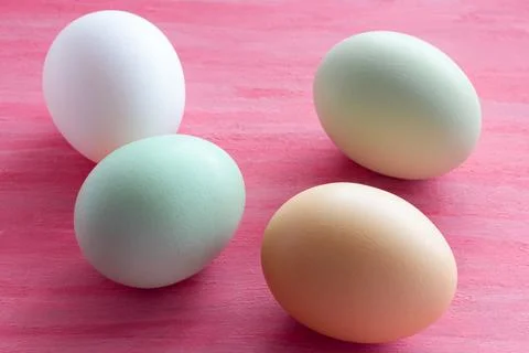 Painted Easter eggs close-up on a pink painted background. Easter Holiday. Stock Photos