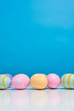 Painted Easter eggs with copy space on background Foto stock