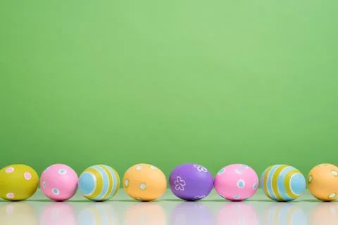 Painted Easter eggs with copy space on background Stock Photos