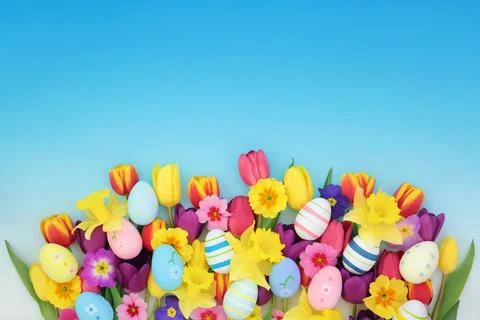 Painted Easter Eggs Fun Treats and Spring Flowers Stock Photos