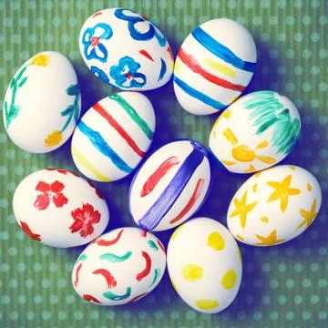 Painted Easter eggs on a green background with white polka dots Foto stock