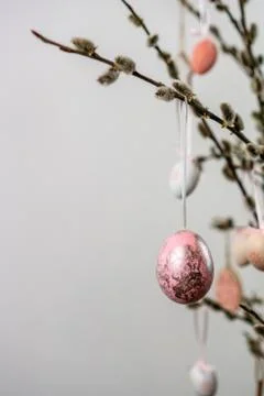 Painted easter eggs hanging from willow tree branches Stock Photos