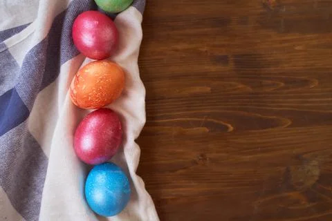 Painted Easter eggs lying on wood background Stock Photos
