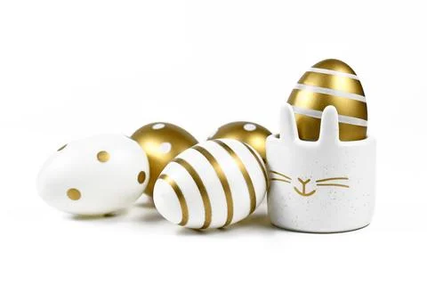 Painted easter eggs with metallic golden and white stripes and dots and cute 写真素材