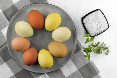Painted Easter eggs on a plate on a white background.Happy Easter Stock Photos