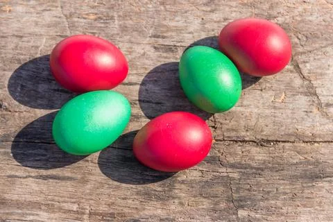 Painted Easter eggs on rustic wooden background Stock Photos