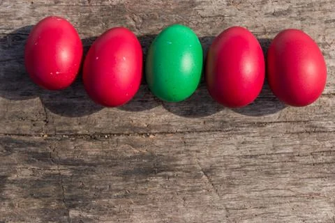 Painted Easter eggs on rustic wooden background Stock Photos
