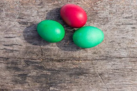 Painted Easter eggs on rustic wooden background Stock Photos