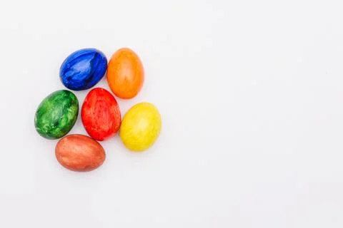 Painted Easter eggs on a white background. Handwork. Stock Photos