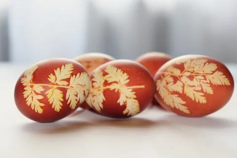 Painted Easter eggs on a white background. Floral pattern on a red eggshell. 스톡 사진