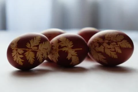 Painted Easter eggs on a white background. Floral pattern on a red eggshell. 스톡 사진
