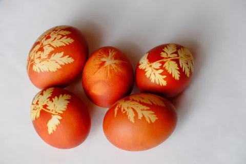 Painted Easter eggs on a white background. Floral pattern on a red eggshell. 스톡 사진