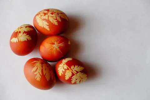 Painted Easter eggs on a white background. Floral pattern on a red eggshell. 스톡 사진