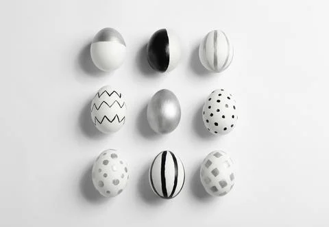 Painted Easter eggs on white background, top view Stock Photos