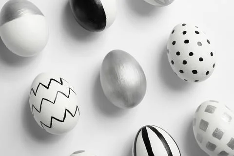 Painted Easter eggs on white background, top view Stock Photos