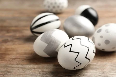 Painted Easter eggs on wooden background, closeup Stock Photos