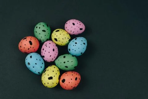 Painted Easter quail eggs isolated on black background. Spring and Easter Stock Photos