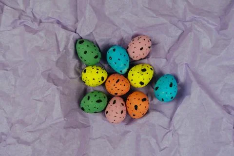 Painted Easter quail eggs isolated on pink textured background. Spring and Stock Photos
