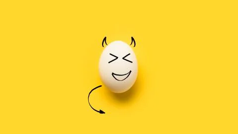 Painted egg with devil isolated on yellow Stock Photos