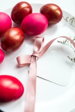 Painted eggs and a note on Easter holiday Stock Photos
