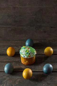 Painted eggs for Easter in the colors of the flag of Ukraine and Easter cake. Stock Photos