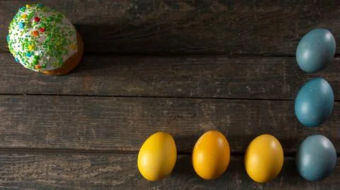 Painted eggs for Easter in the colors of the flag of Ukraine and Easter cake. Stock Photos