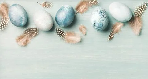 Painted eggs for Easter over light blue background Stock Photos