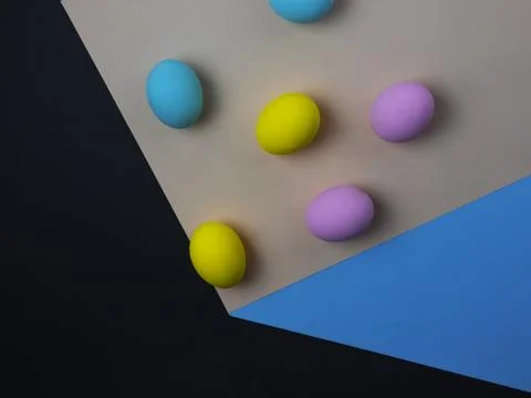 Painted eggs falling down, paper cube optical illusion, easter concept, copy  Stock Photos